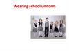 Wearing school uniform